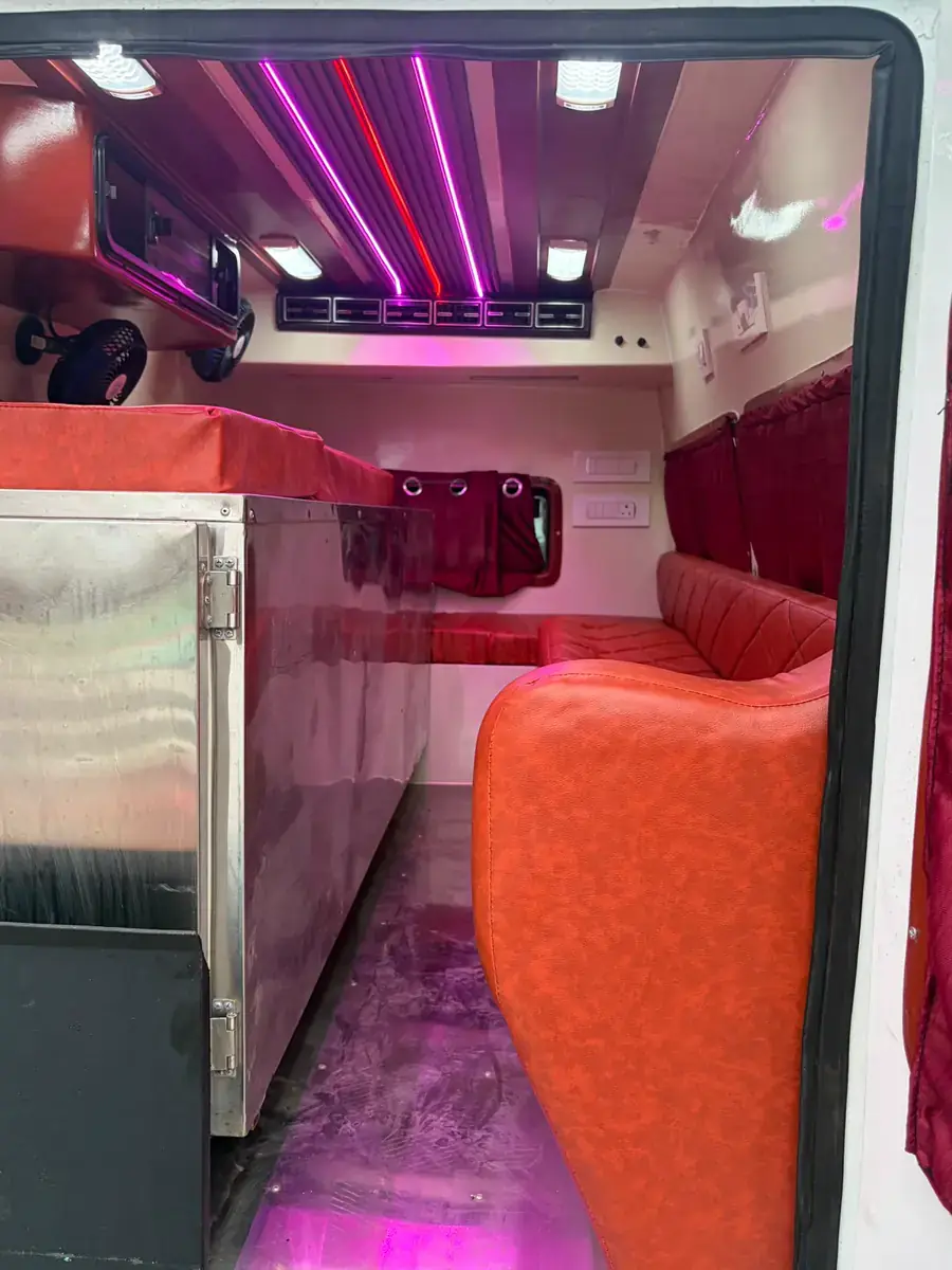 Freezer box and cushioned seating inside a JMB ambulance
